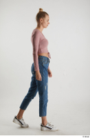  Kate Jones  1 blue jeans casual dressed pink long sleeve t shirt side view walking white sneakers whole body 0002.jpg